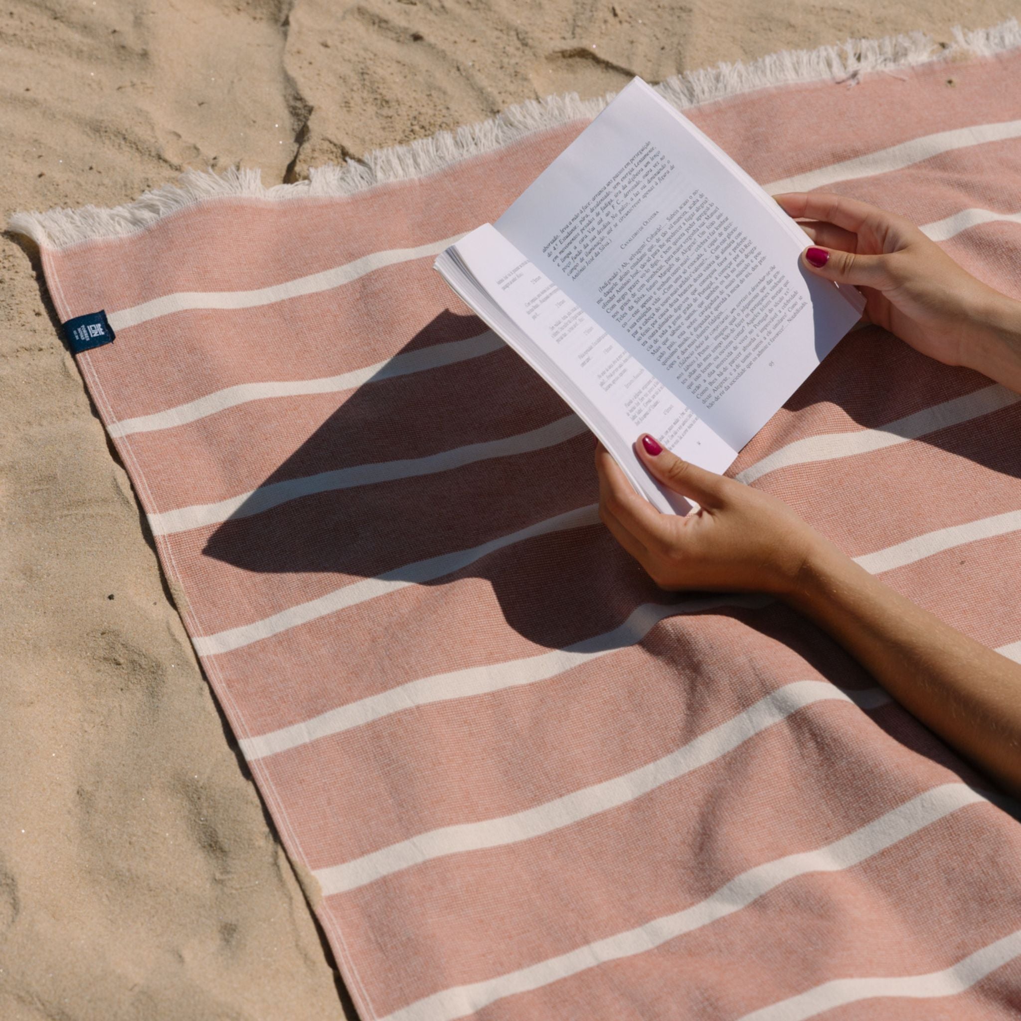 torres-novas-beach-belem-horizontal-stripes-towel-terracotta-lifestyle-1.jpg