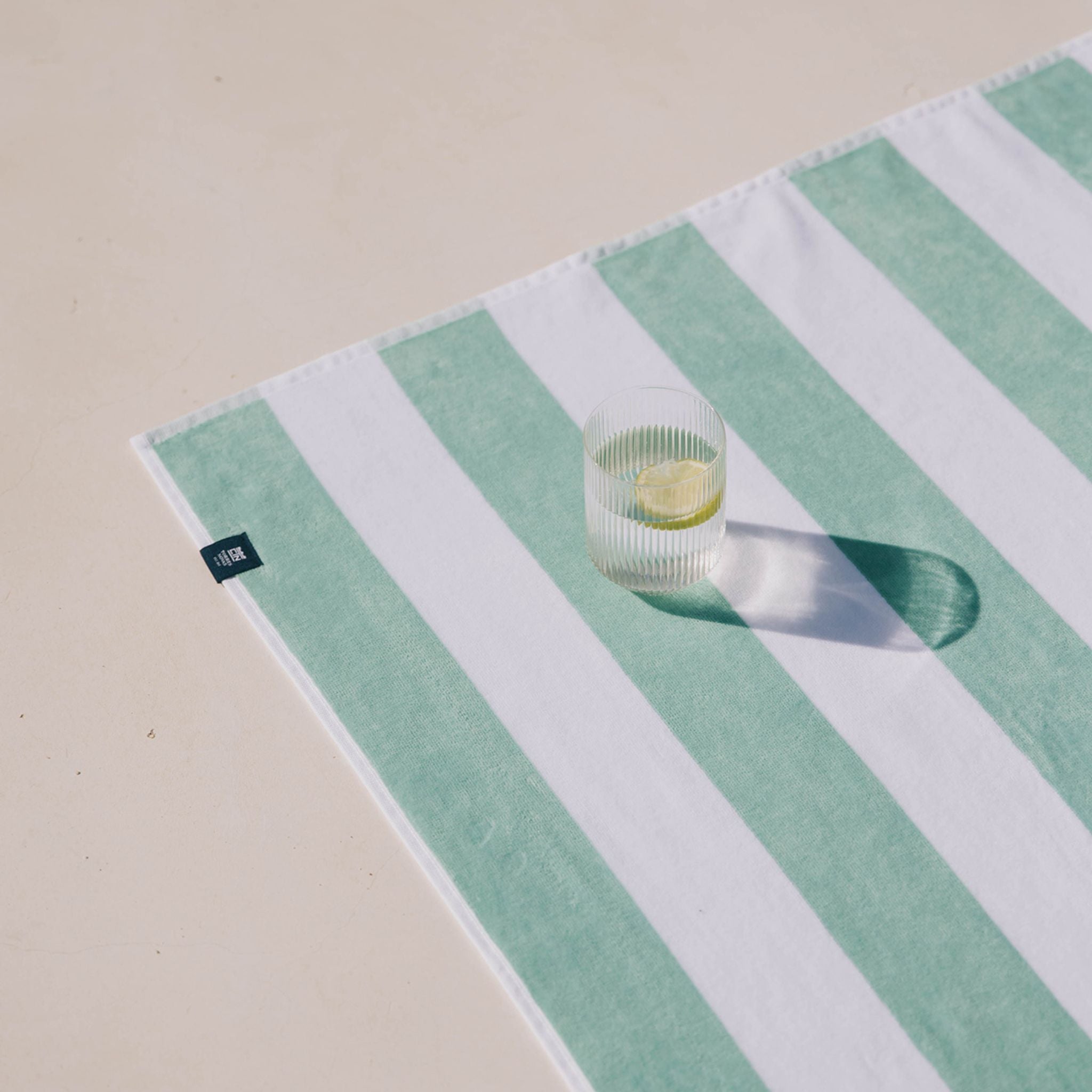 torres-novas-beach-gibalta-vertical-stripes-towel-green-lifestyle-1.jpg