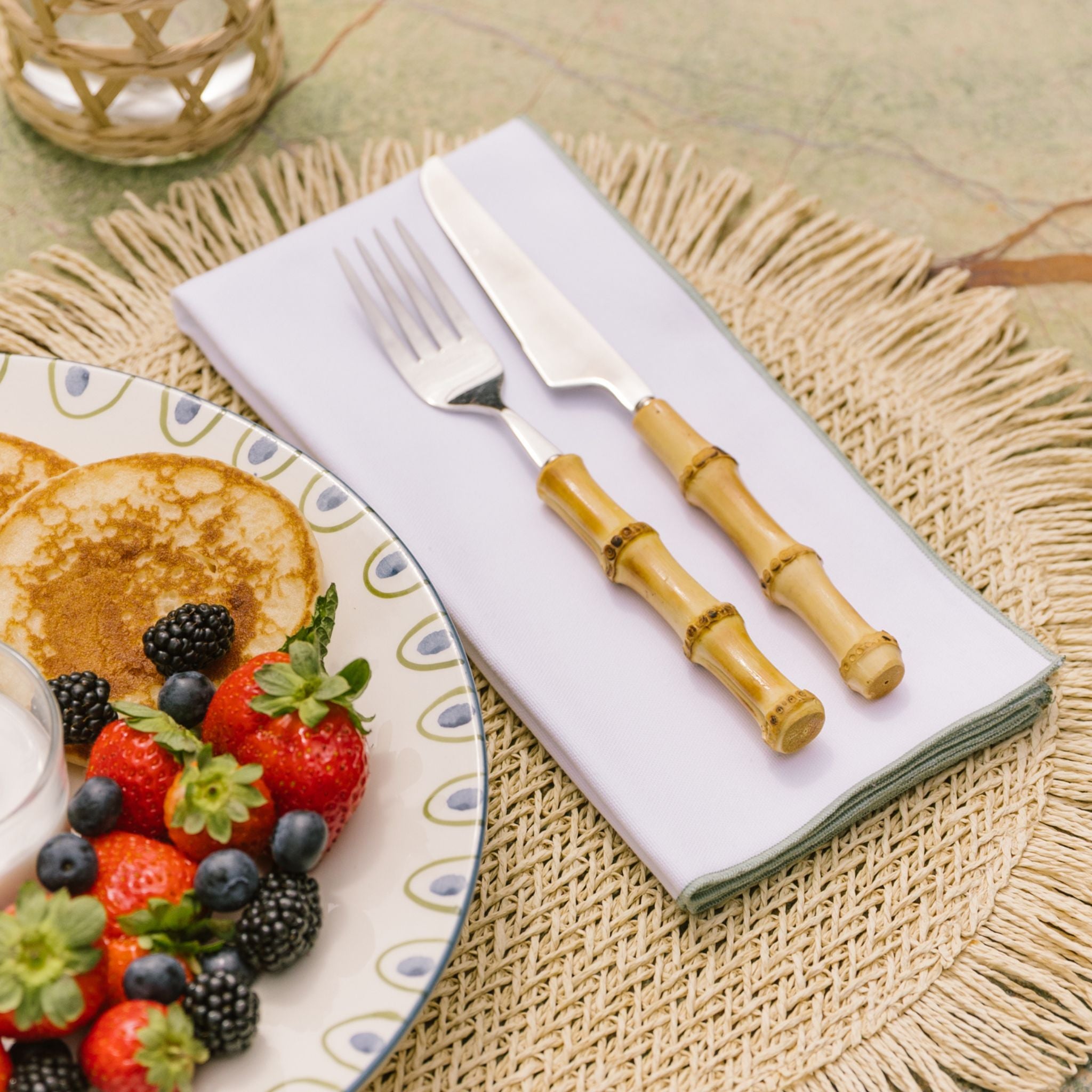 torres-novas-table-nazare-solid-white-napkin-green-lifestyle.jpg